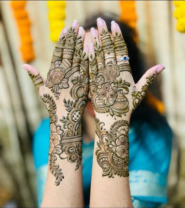 Simple engagement mehndi design with floral vine on wrist