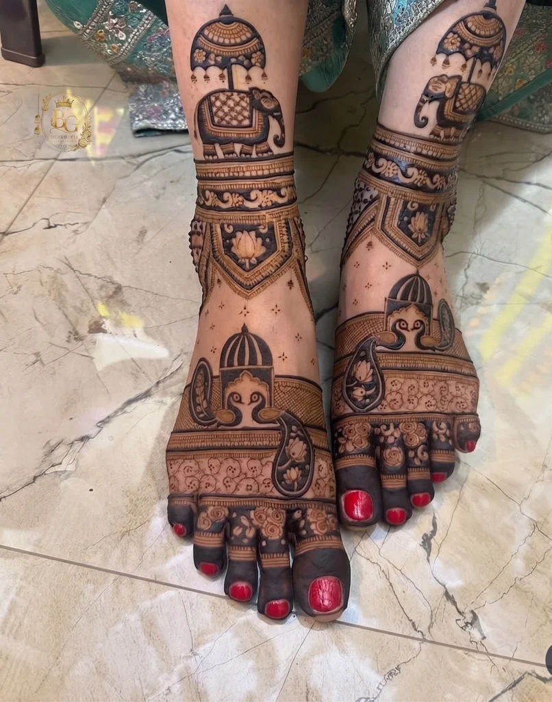 Intricate bridal feet mehndi design featuring detailed elephant and peacock motifs with traditional Indian patterns.