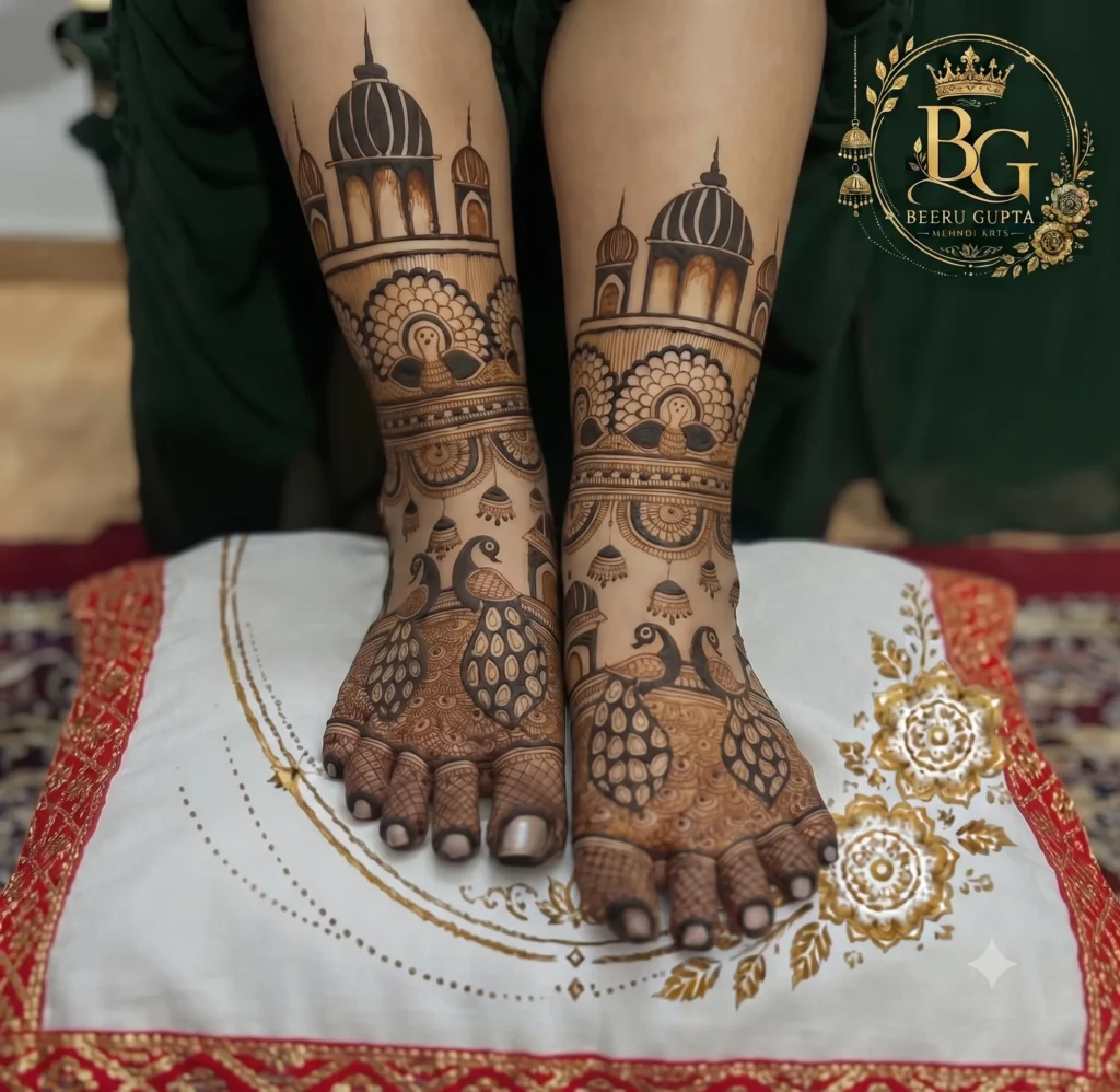 Traditional bridal feet mehndi design featuring peacock motifs and palace-inspired artwork created by Beeru Gupta Mehndi Artist in Gurgaon.
