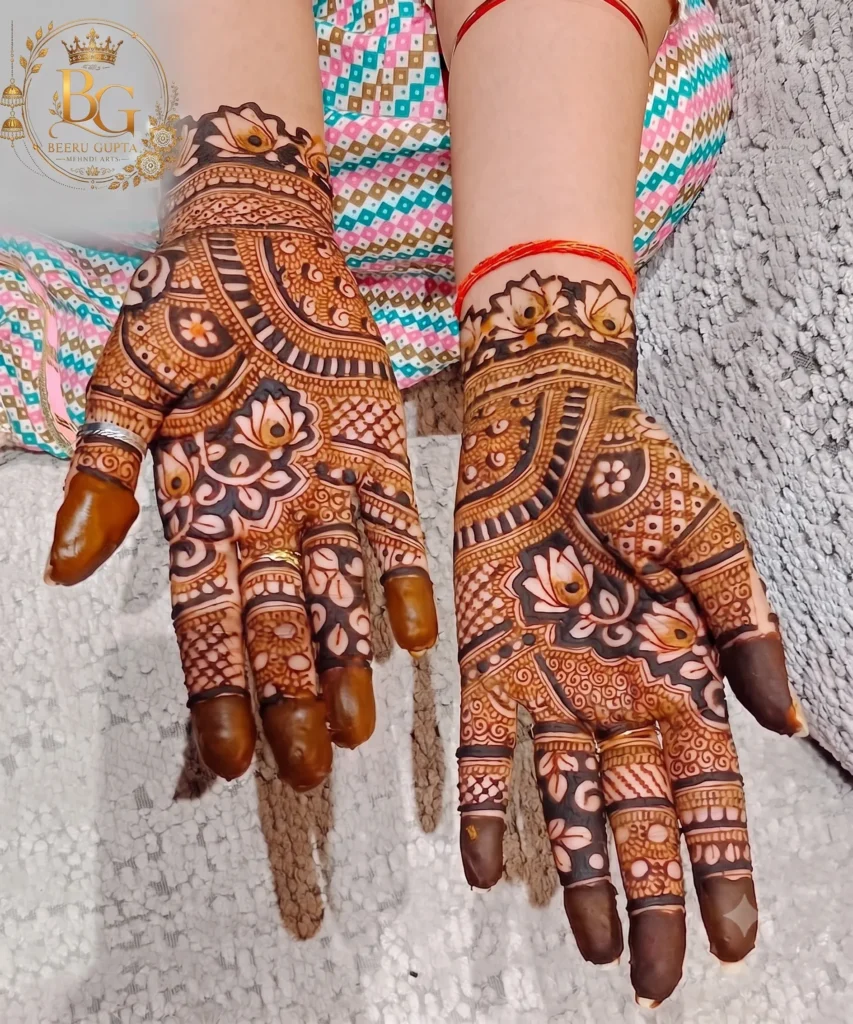 Floral bridal mehndi design with lotus flowers and dark henna stain for brides