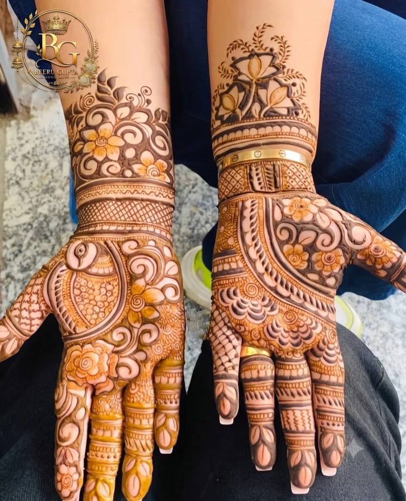 Floral front hand mehndi design with bracelet pattern and flower motifs.