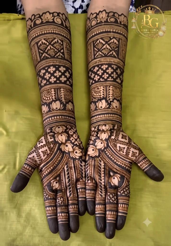 Royal full hand bridal mehndi design with floral and geometric patterns by Beeru Gupta Mehndi Arts in Delhi NCR.